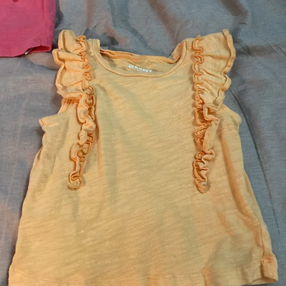 2 sleeveless shirts